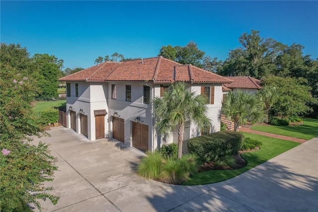 view of property exterior featuring a yard and a garage