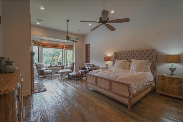 bedroom with ceiling fan and dark wood-type flooring