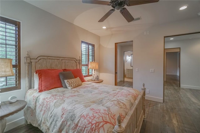 bedroom with ensuite bathroom, ceiling fan, and dark hardwood / wood-style flooring