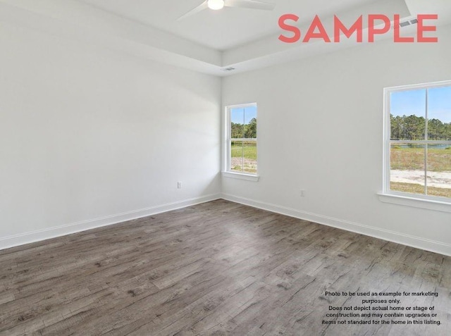 empty room with ceiling fan and wood-type flooring