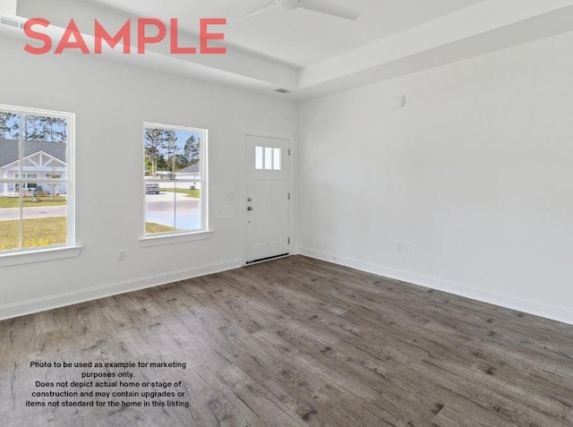 unfurnished room with ceiling fan and hardwood / wood-style flooring