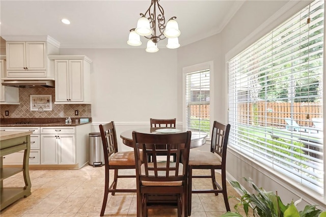 100 Southern Oaks Ln, Saint Simons Island, GA 31522 - dining space featuring a chandelier, ornamental molding, light tile patterned floors, and recessed lighting