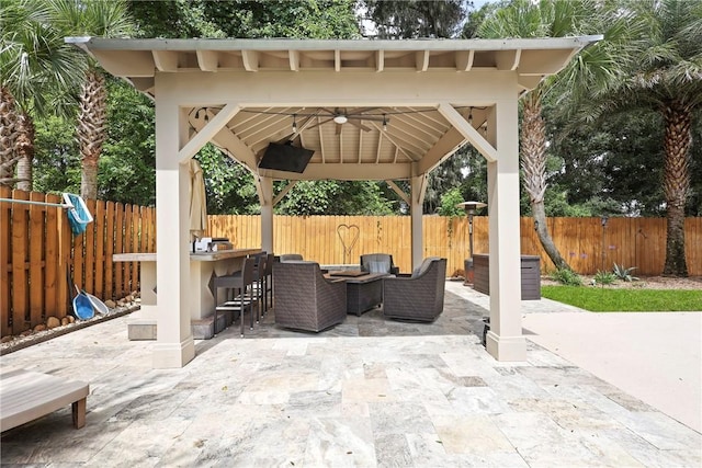 100 Southern Oaks Ln, Saint Simons Island, GA 31522 - fenced backyard with a gazebo, a patio, and an outdoor hangout area