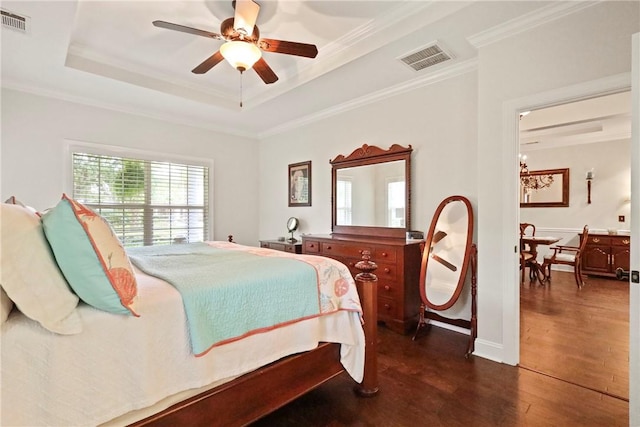 100 Southern Oaks Ln, Saint Simons Island, GA 31522 - bedroom featuring dark wood finished floors, crown molding, a tray ceiling, and ceiling fan