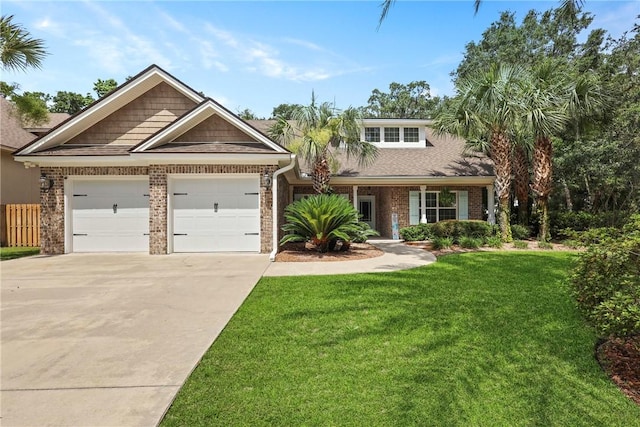 100 Southern Oaks Ln, Saint Simons Island, GA 31522 - view of front of property featuring an attached garage, driveway, brick siding, and a front lawn