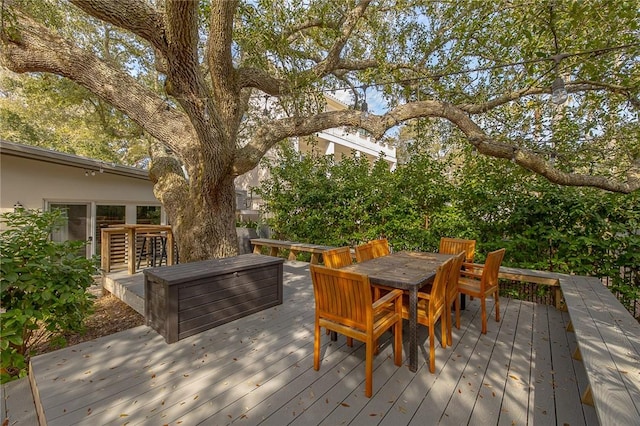 wooden deck with outdoor dining space