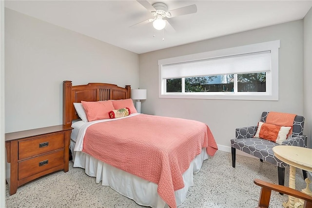 bedroom featuring ceiling fan, speckled floor, and baseboards