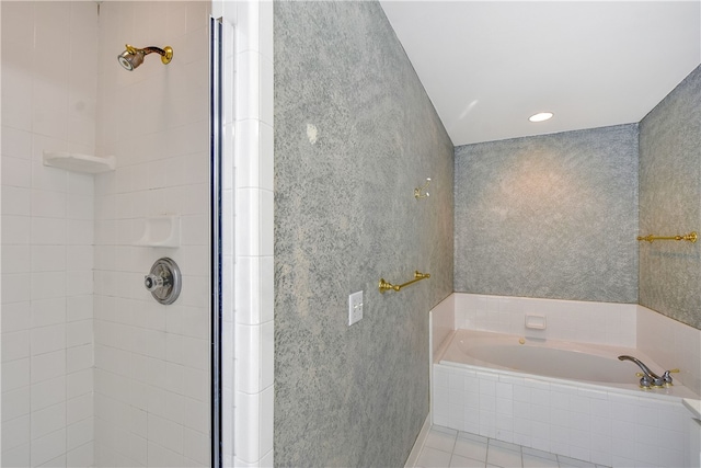 bathroom with tile patterned flooring and separate shower and tub