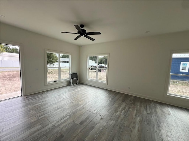 1011 Elbert St, Darien, GA 31305 - spare room featuring ceiling fan and dark hardwood / wood-style flooring