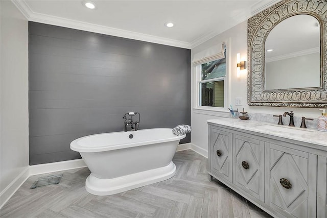 205 Palmetto St, Saint Simons Island, GA 31522 - bathroom with vanity, a soaking tub, ornamental molding, and recessed lighting