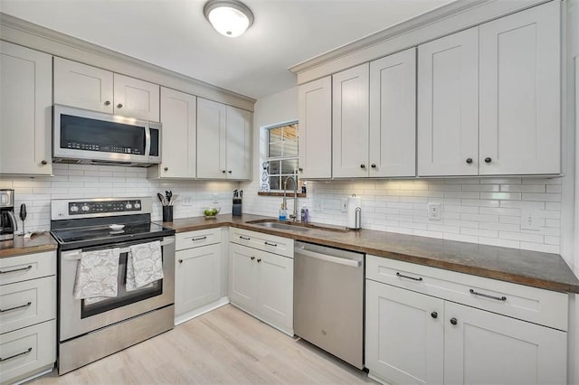 205 Palmetto St, Saint Simons Island, GA 31522 - kitchen with appliances with stainless steel finishes, decorative backsplash, and wooden counters