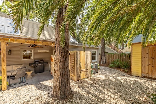 205 Palmetto St, Saint Simons Island, GA 31522 - view of home's exterior featuring a patio area and ceiling fan