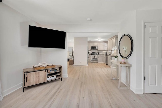205 Palmetto St, Saint Simons Island, GA 31522 - living area with light wood-type flooring and baseboards