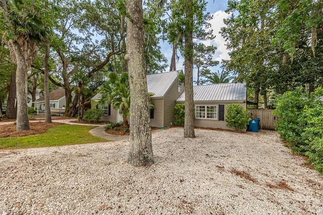 205 Palmetto St, Saint Simons Island, GA 31522 - ranch-style home featuring driveway and a metal roof
