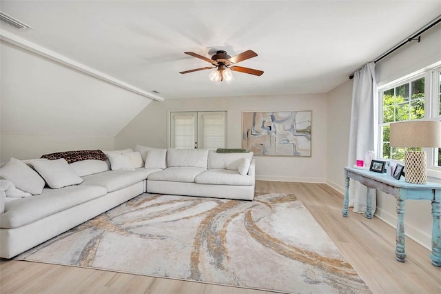 205 Palmetto St, Saint Simons Island, GA 31522 - living area with wood finished floors, a ceiling fan, and lofted ceiling