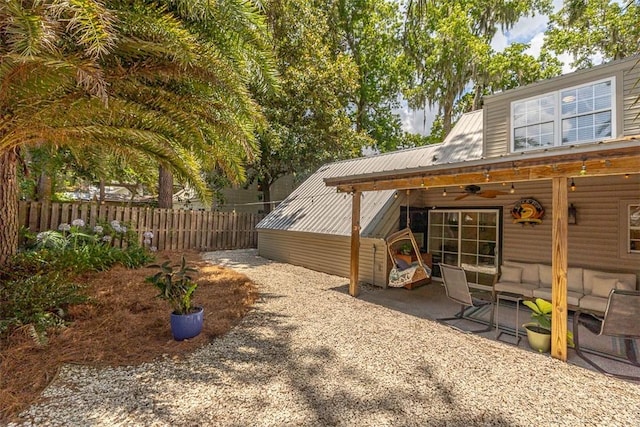 205 Palmetto St, Saint Simons Island, GA 31522 - view of yard with ceiling fan and a patio
