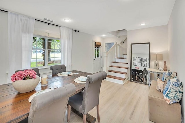 205 Palmetto St, Saint Simons Island, GA 31522 - dining space with stairway, light wood-style flooring, and recessed lighting