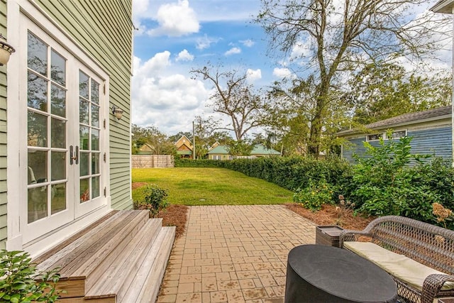 view of patio / terrace with french doors and fence