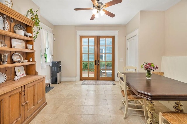 doorway to outside featuring light tile patterned floors, ceiling fan, french doors, and baseboards