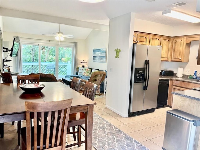 kitchen with dishwasher, vaulted ceiling, ceiling fan, light tile patterned flooring, and stainless steel fridge with ice dispenser