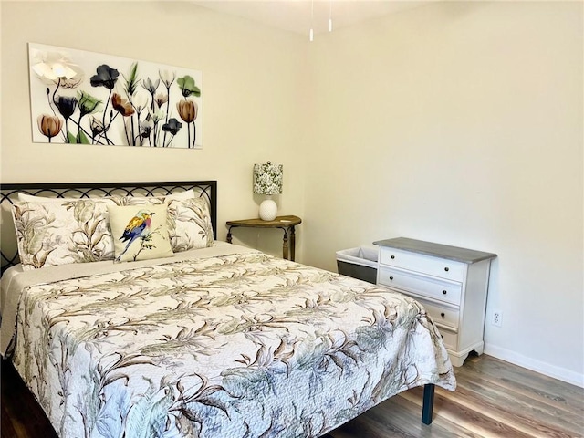 bedroom featuring dark hardwood / wood-style floors