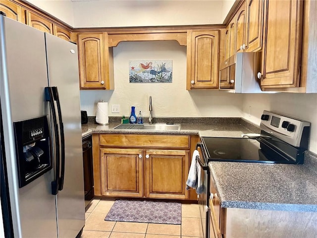 kitchen featuring sink, light tile patterned floors, and appliances with stainless steel finishes