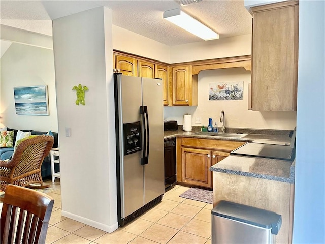 kitchen featuring sink, black dishwasher, stainless steel fridge with ice dispenser, a textured ceiling, and light tile patterned floors