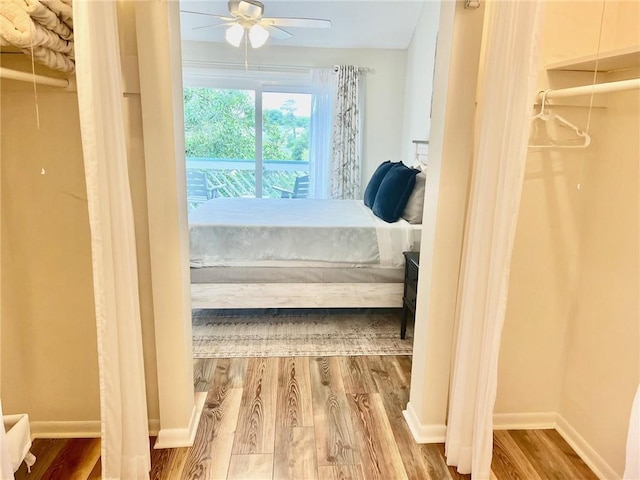 bedroom with hardwood / wood-style flooring and ceiling fan