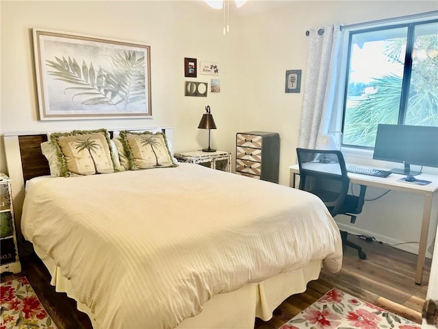 bedroom featuring dark hardwood / wood-style flooring