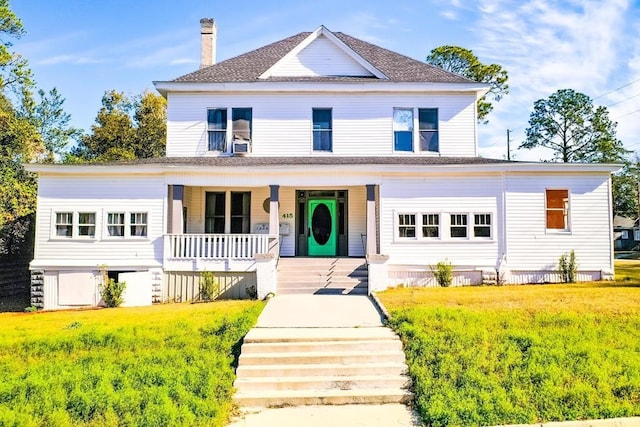 415 Dewey St, Waycross, GA 31501 - view of front of home featuring covered porch, a chimney, a front yard, and roof with shingles