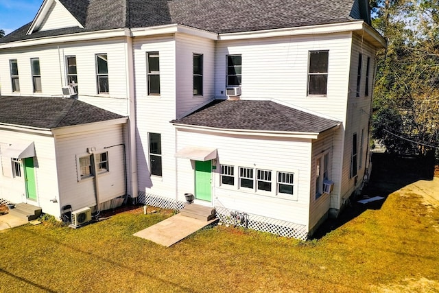 415 Dewey St, Waycross, GA 31501 - rear view of property featuring entry steps, a lawn, and a shingled roof