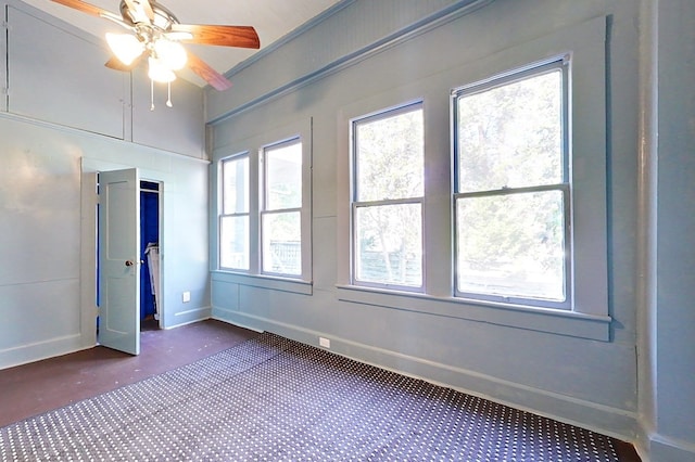 415 Dewey St, Waycross, GA 31501 - unfurnished bedroom featuring multiple windows and ceiling fan
