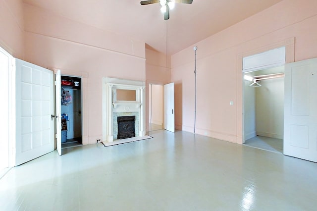 415 Dewey St, Waycross, GA 31501 - unfurnished living room with ceiling fan, a fireplace, and a towering ceiling