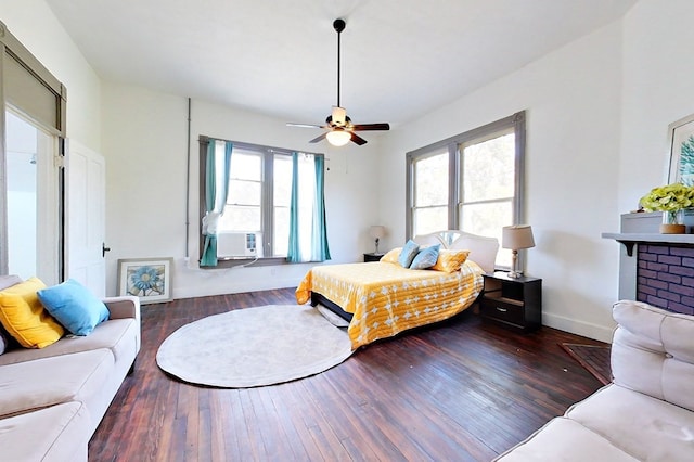 415 Dewey St, Waycross, GA 31501 - bedroom featuring multiple windows, hardwood / wood-style floors, cooling unit, and a ceiling fan
