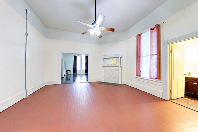 415 Dewey St, Waycross, GA 31501 - unfurnished living room featuring a ceiling fan and wood finished floors