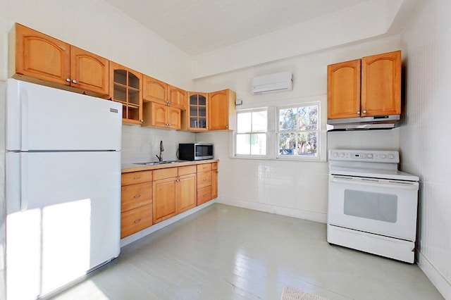 415 Dewey St, Waycross, GA 31501 - kitchen featuring white appliances, under cabinet range hood, a wall mounted air conditioner, glass insert cabinets, and tasteful backsplash