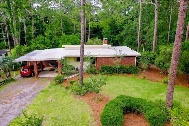 view from above of property with a heavily wooded area