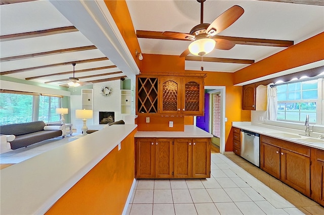 kitchen featuring a sink, ceiling fan, dishwasher, and brown cabinetry