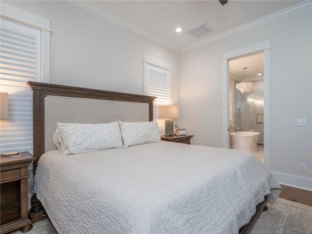 bedroom featuring ensuite bathroom, ornamental molding, hardwood / wood-style floors, and a chandelier