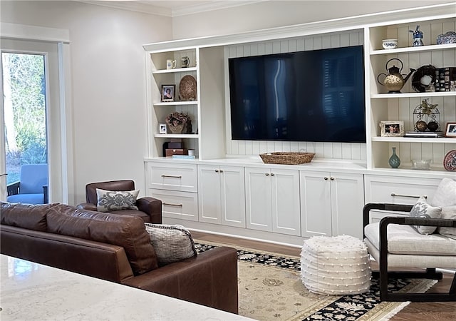 living room with ornamental molding and hardwood / wood-style flooring