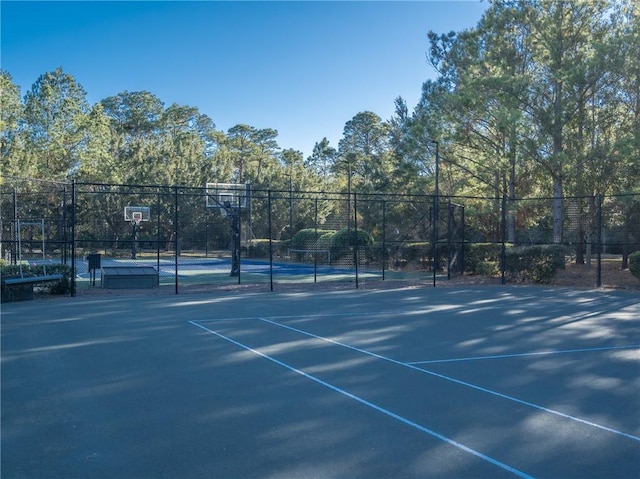 view of sport court with basketball hoop