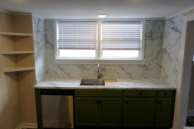 kitchen featuring stainless steel dishwasher, light stone countertops, sink, and green cabinetry