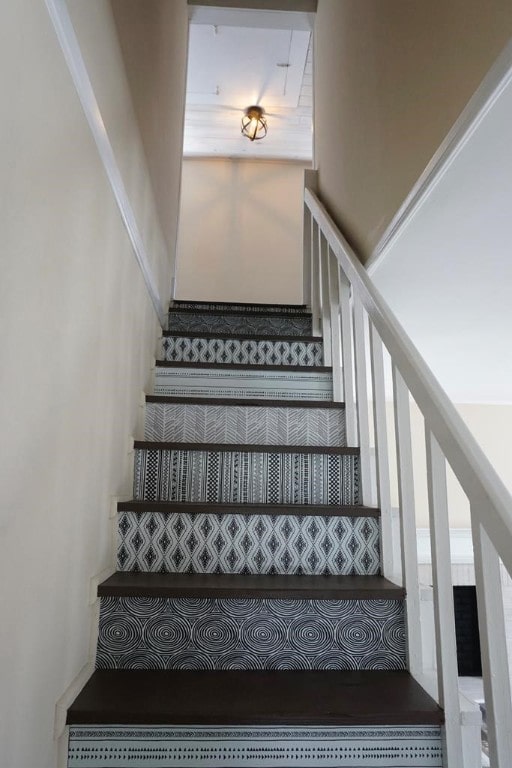 staircase featuring hardwood / wood-style floors