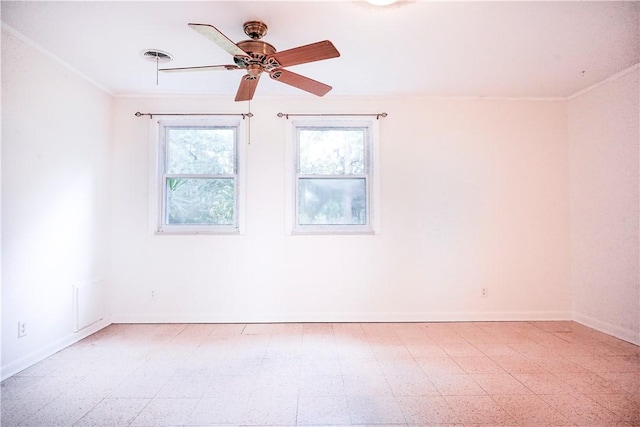 empty room with ceiling fan and ornamental molding