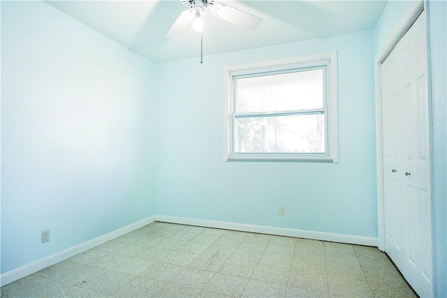 spare room with ceiling fan