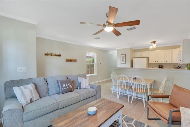 tiled living room featuring ceiling fan and ornamental molding