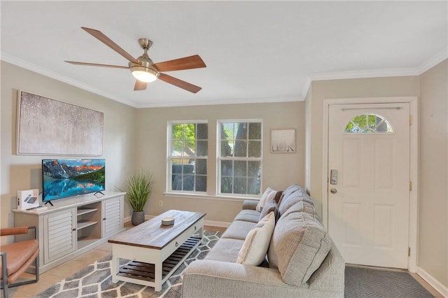 living room featuring light tile patterned flooring, a wealth of natural light, ornamental molding, and ceiling fan