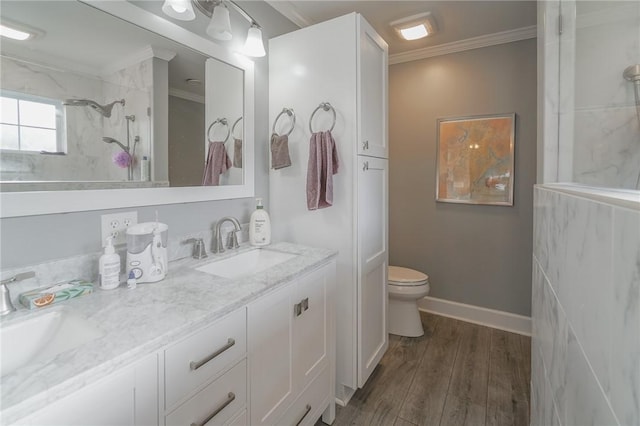 12 Wimbledon Ct, Saint Simons Island, GA 31522 - bathroom featuring crown molding, toilet, double vanity, a shower, and wood finished floors