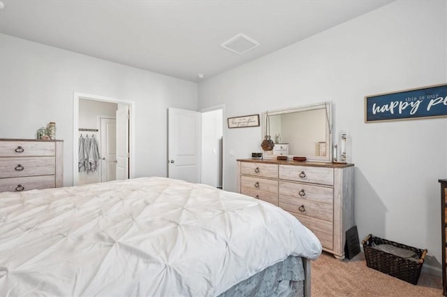 bedroom featuring light carpet