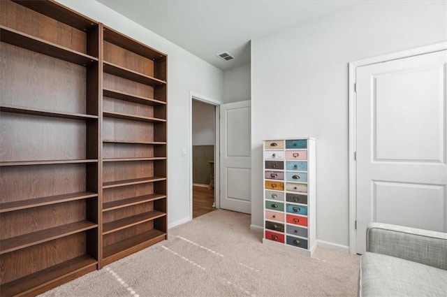 unfurnished bedroom with light colored carpet